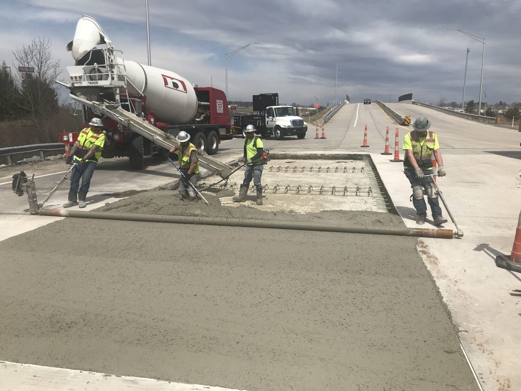 pouring concrete for toll plaza construction project